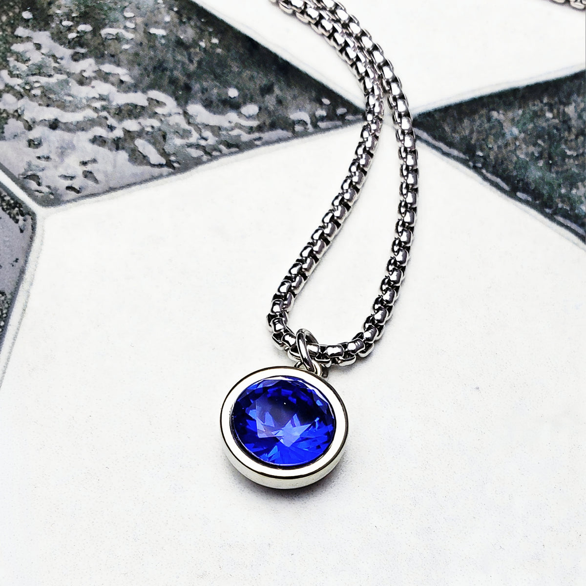 Collana con moneta in zaffiro e argento