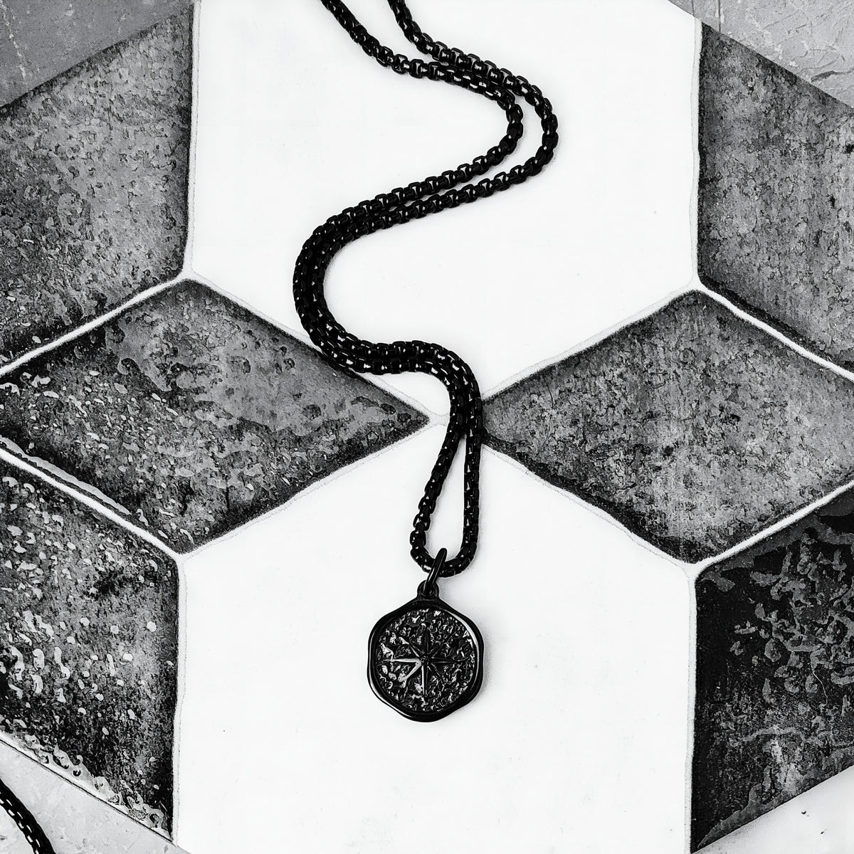 Hammered Black North Star Coin