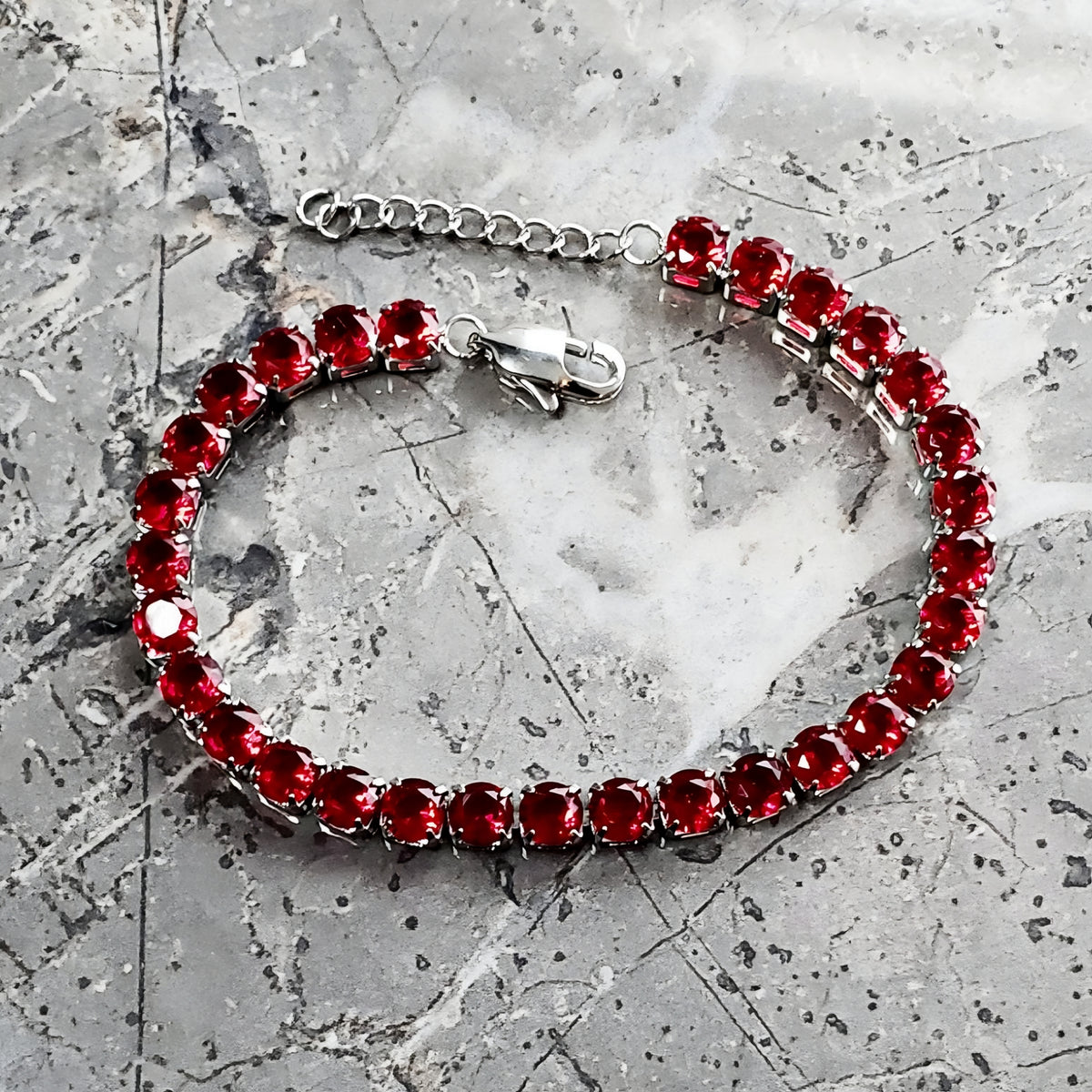Bracciale tennis con granato e argento