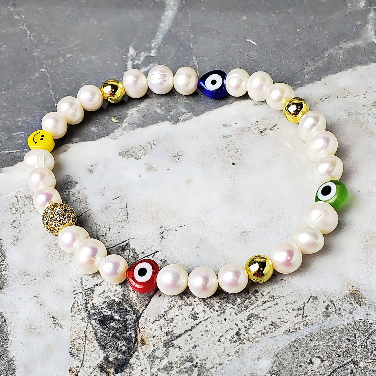 Bracciale con perle e occhio malvagio