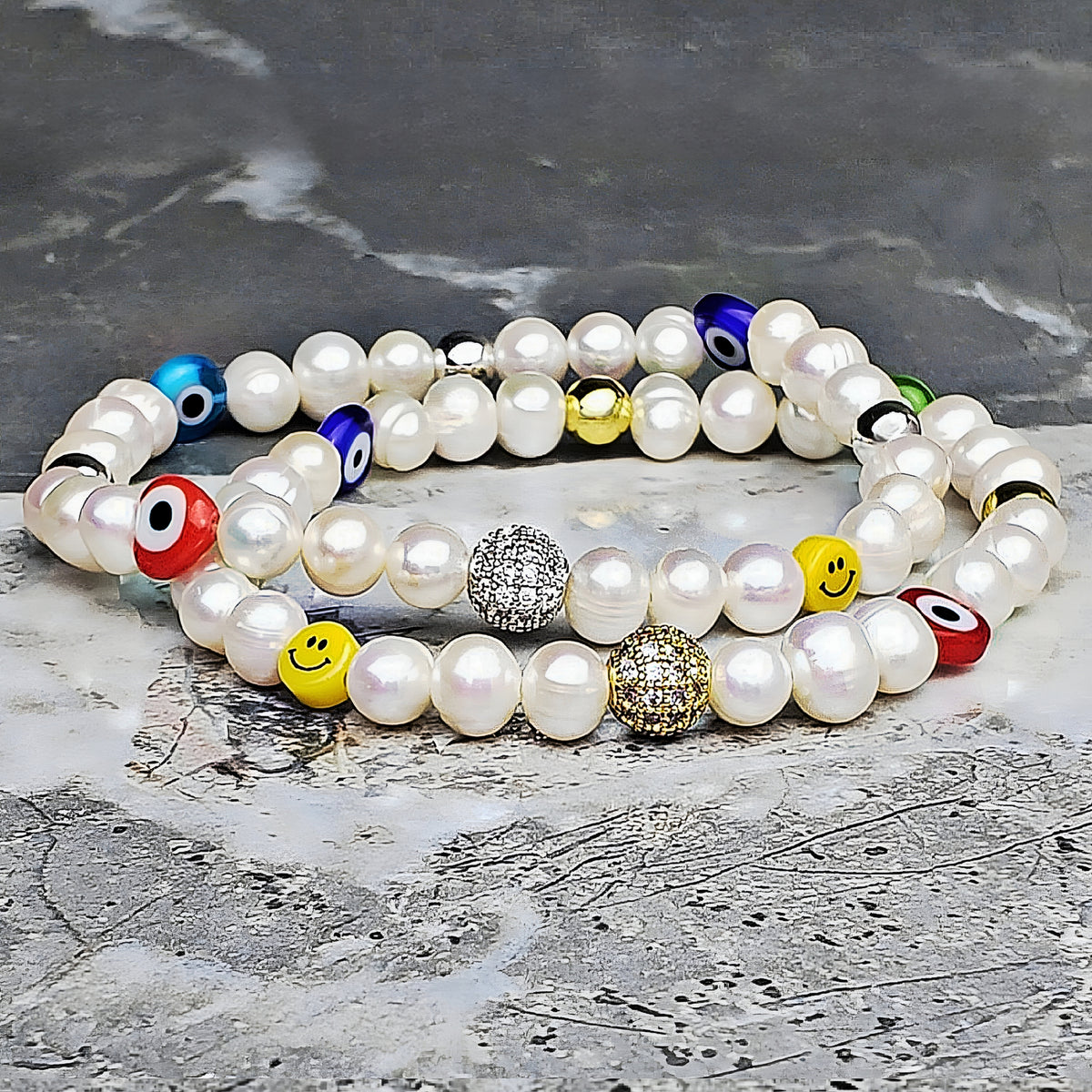 Bracciale con perle e occhio malvagio